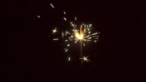 Firework sparkler burning on black background in slow motion Stock Footage 86242994