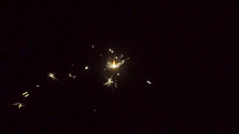 Firework sparkler burning on black background in slow motion Stock Footage 86247956