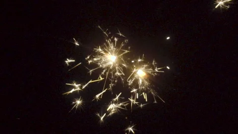 Firework sparkler burning on black background in slow motion Stock Footage 86248552