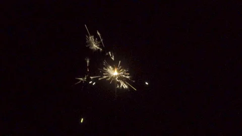 Firework sparkler burning on black background in slow motion Stock Footage 86462086
