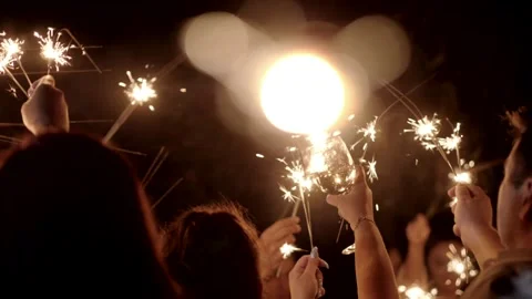 Firework sparkler burning with lights in background. Stock Footage 166703885