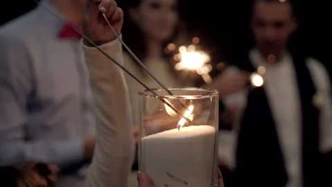 Firework sparkler burning with lights in background. Stock Footage 166706266