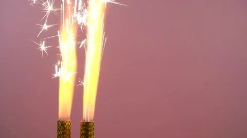 Firework sparklers burning on pink background. Stock Footage 279884624