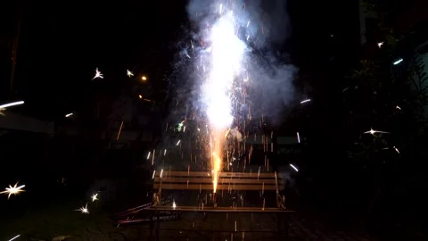 Firework torch exploding and sparkling on bench in backyard Stock Footage 154580155