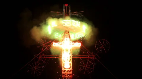 Firework tower burns during village feast, at the top there is a cross. Stock Footage 49678100