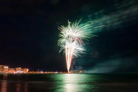 Firework trail with reflections on the water Stock Photos