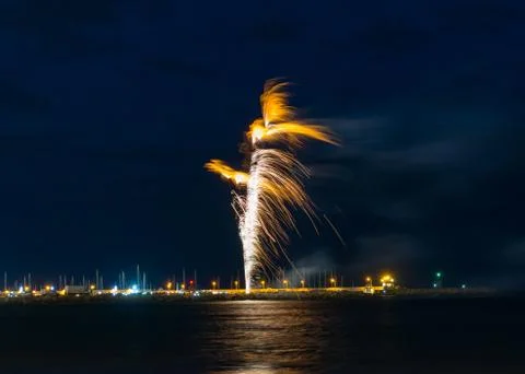 Firework trail with reflections on the water Stock Photos