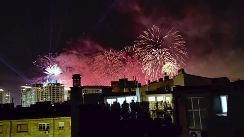 Fireworks and lasers above the roofs for the new year Stock Footage 270149088