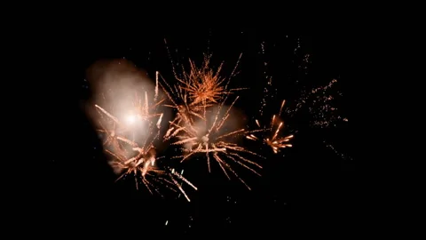Fireworks animation with golden sparks exploding against black background Stock Footage 310820399