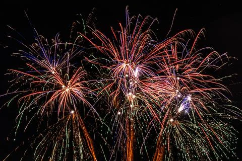 Fireworks are a class of low explosive pyrotechnic devices used for aesthet.. Stock Photos