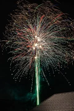 Fireworks are a class of low explosive pyrotechnic devices used for aesthet.. Stock Photos