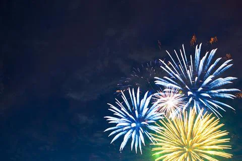 Fireworks on the background of the cloudy night sky. 4th of July - American Stock Photos