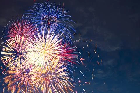 Fireworks on the background of the dark night sky. 4th July - American Stock Photos