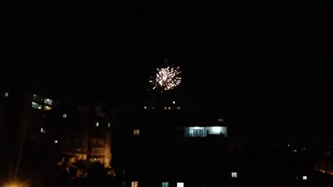 Fireworks behind the buildings Stock Footage 83187775