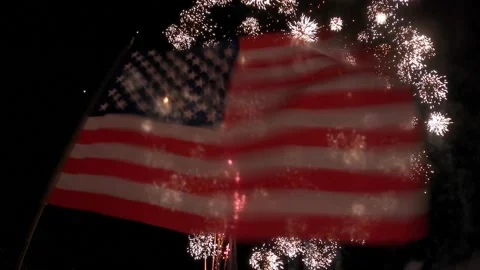 Fireworks behind flag Stock Footage 157240464