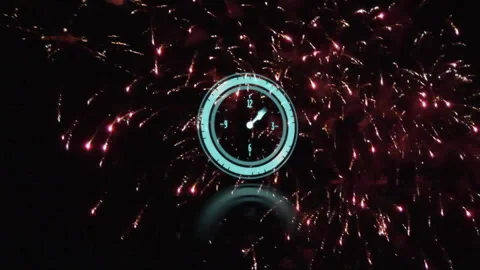 Fireworks bursting behind clock starting second hand ticking to midnight while Stock Footage 310729058