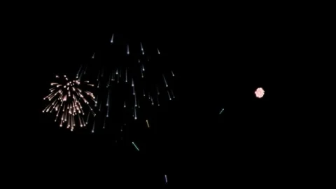 Fireworks collide and explode in the dark of night 스톡 동영상 321013616