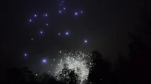 Fireworks cracking against a black sky in the night Stock Footage 49737422