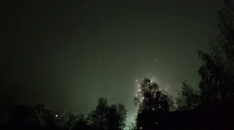 Fireworks cracking against a black sky in the night Stock Footage 49738037