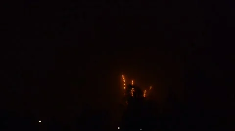Fireworks cracking against a black sky in the night Stock Footage 49738076