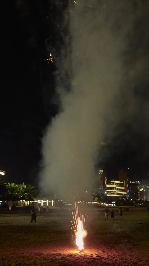 Fireworks creating a large cloud of smoke against the dark night sky, with Stock Footage 341859668