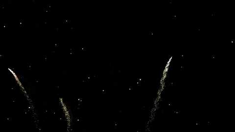Fireworks display exploding against black sky Stock Footage 100520888