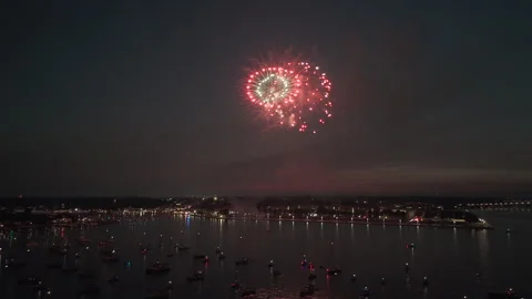 Fireworks Display Exploding In The Night Sky Over Harbor With Lit Boats In Stockbeeldmateriaal 337618190