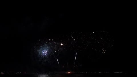 Fireworks Display Exploding Over The Dark Sea In Pattaya Thailand Wide Shot Video stock 337998694