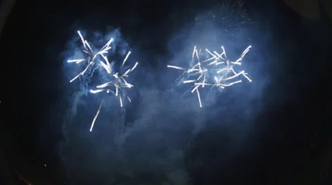 Fireworks display with multiple rockets launching from below frame and Stock Footage 59516488