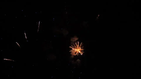 Fireworks draw amazing pattern of sparkling blasts in black night sky Stock Footage 257868239