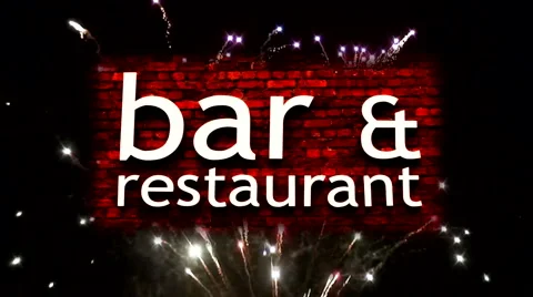 Fireworks explode behind bar, restaurant sign 1 Stock Footage 938035