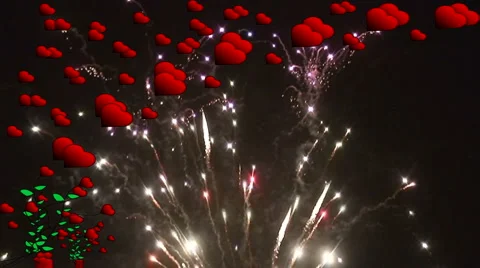 Fireworks explode behind high res red hearts 3 Stock Footage 935720