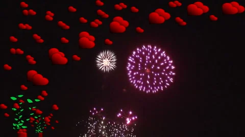 Fireworks explode behind high res red hearts 2 Stock Footage 935762