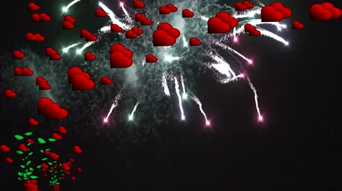 Fireworks explode behind high res red hearts 1 Stock Footage 935814
