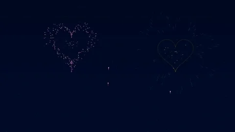 Fireworks explode in heart shapes for Valentines Day celebration Stock Footage 326514425