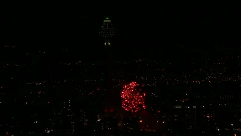 Fireworks explode in the night sky above Milad Tower in Tehran Stock-Footage 317910087