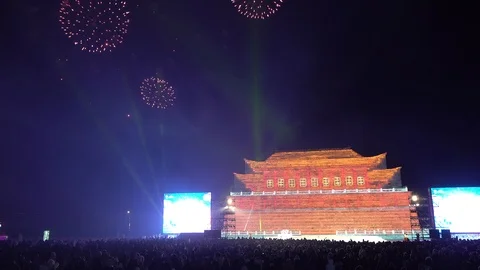 Fireworks exploding above illuminated ice palace at  Harbin ice festival China 스톡 동영상 112447386