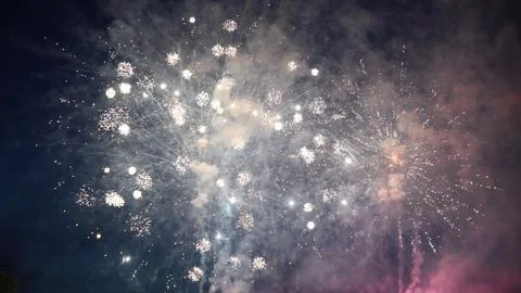 Fireworks exploding, creating a mesmerizing spectacle in the night sky Stock Photos
