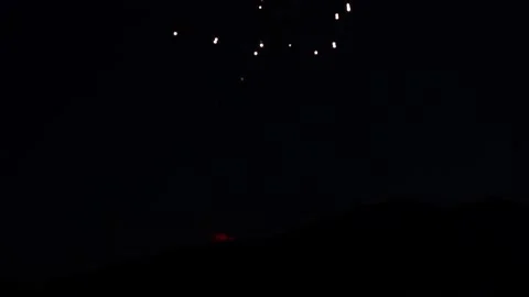 Fireworks exploding in dark of night Stock Footage 167987610