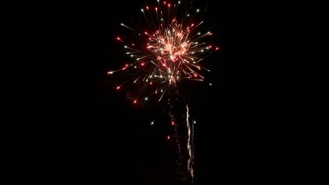 Fireworks exploding in the dark night sky Stock Footage 122984432