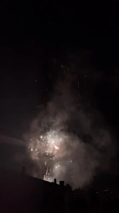 Fireworks exploding in the dark night sky over Olot, Spain Stock-Footage 345047654