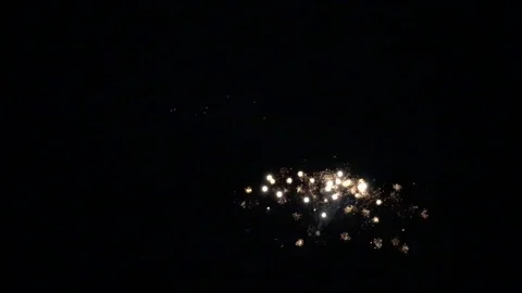 Fireworks exploding in dark sky for New Year's Eve Video stock 120021170