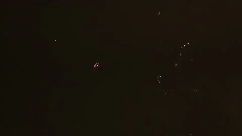 Fireworks exploding in the night sky with bright colors Stock Footage 168249803