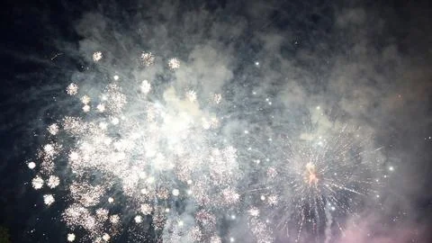 Fireworks exploding in the night sky creating a magical atmosphere Stock Photos