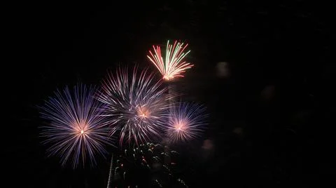 Fireworks exploding in the night sky during fourth of july Photos
