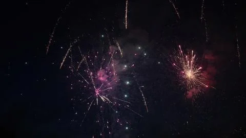 Fireworks exploding in the night sky during a celebration Stock Photos