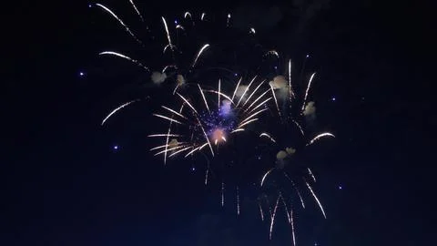 Fireworks exploding in the night sky during a celebration Stock Photos
