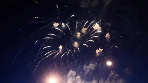 Fireworks exploding in the night sky during a celebration Foto stock