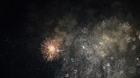Fireworks exploding in the night sky during a celebration Stock Photos