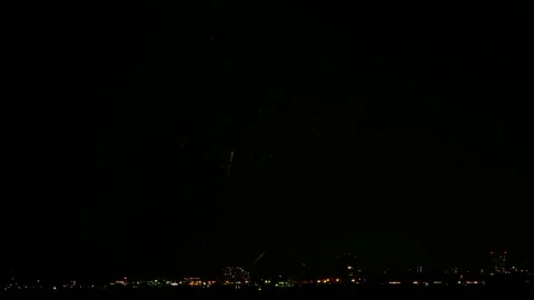 Fireworks exploding in the night sky. Explosion of pyrotechnics. 4K Stock Footage 212372113